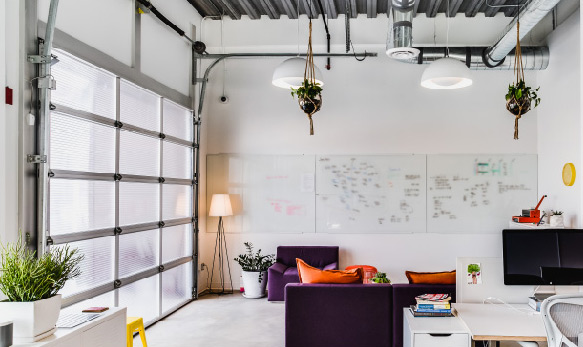 A view of our office with a filled-up whiteboard.