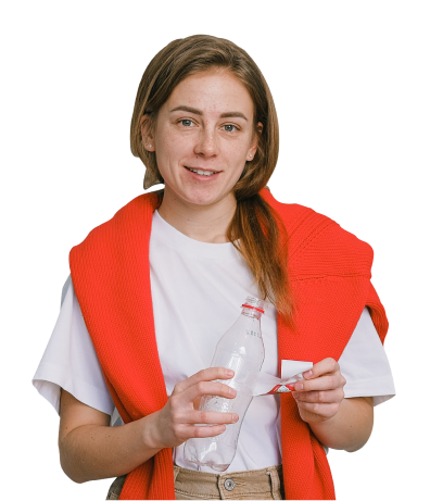 An image of a woman unwrapping the label off a plastic bottle